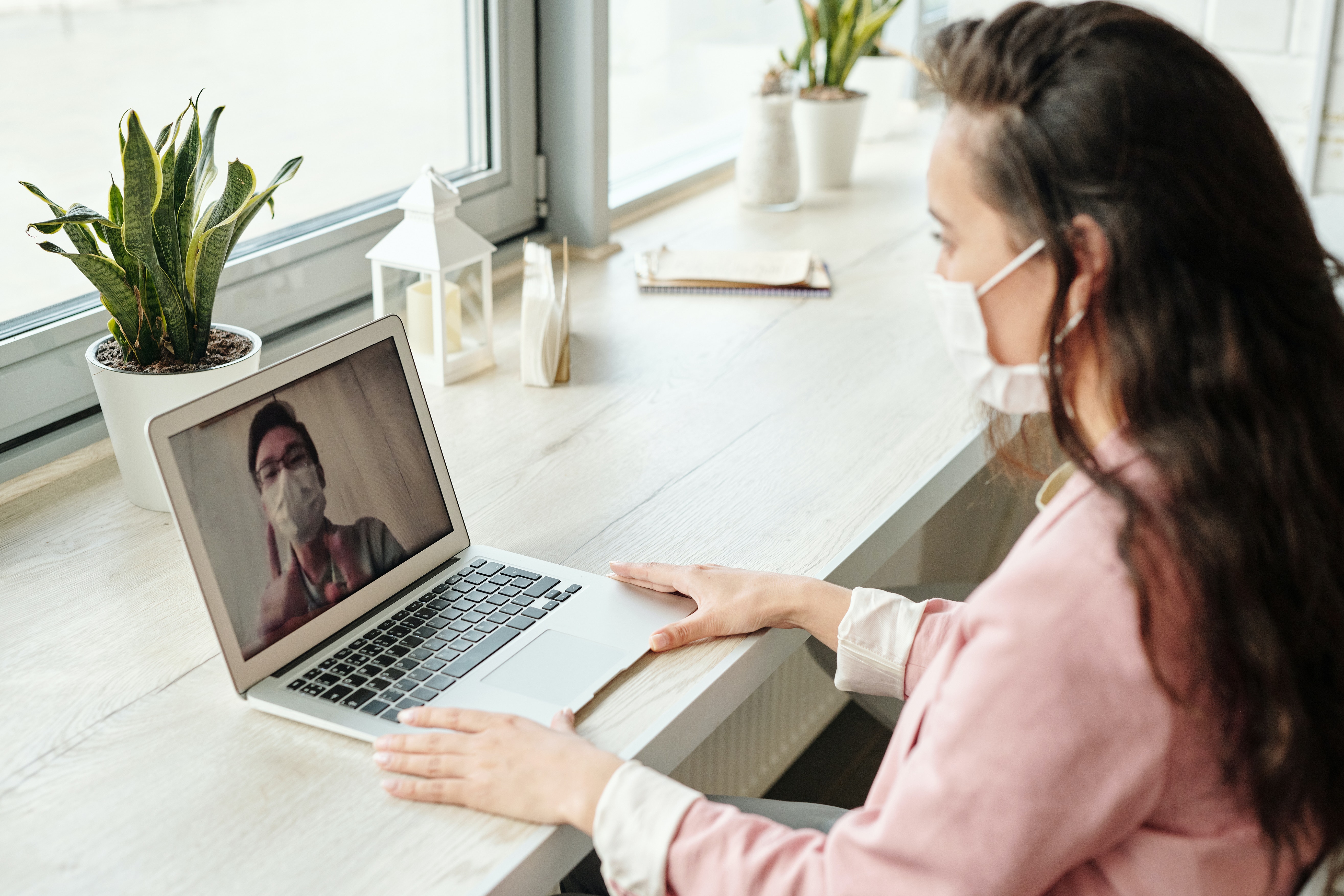 A photo of a telehealth talking to their client, clicking will take you to "services" page 